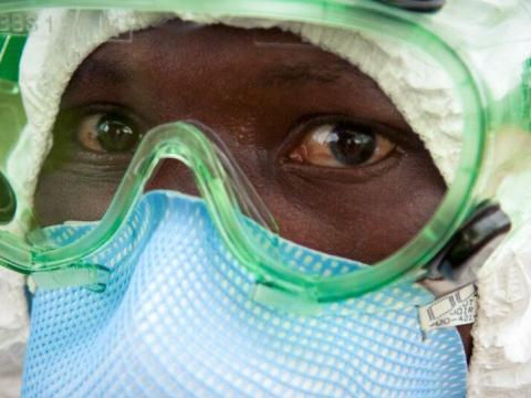 World Vision worker in protective gear against Ebola