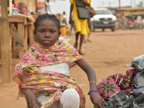 A child involved in child labour in her community