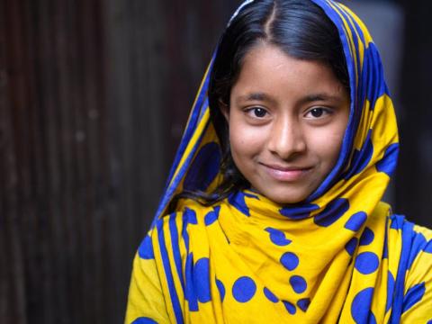 child with headscarf