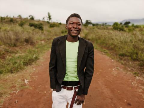Moses a young boy from Malawi stands tall and proud. He is the first one from his family and his community to go to university thanks to child sponsorship
