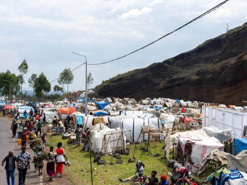 Families are camped in an informal settlement in eastern DRC, displaced by violence