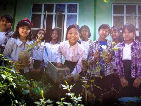 Children with plants in Asia
