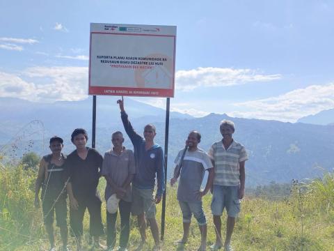 Marques and friends with Water Spring Protection project sign-Bobonaro Timor-Leste
