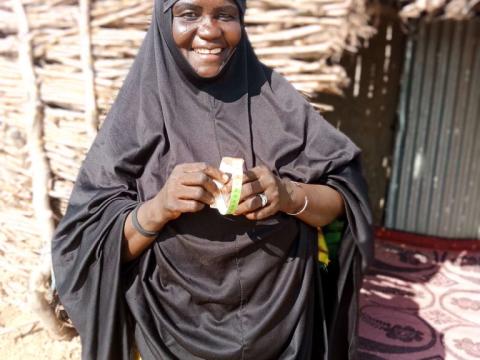 Halima holding a perimeter brachial she uses to weigh children