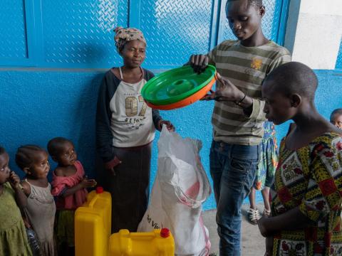 Germaine with her family after receiving a Wash kit