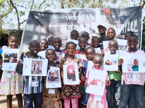 Children with sponsor photos 