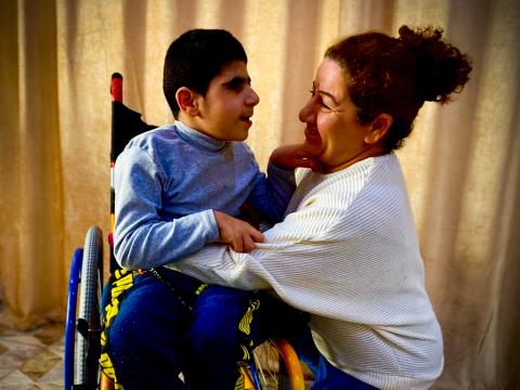 A beneficiary with her son