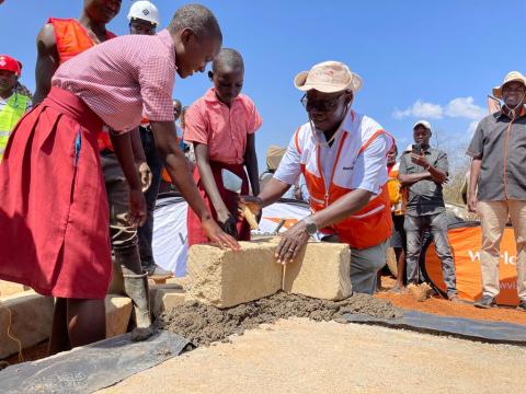 Gilbert Kamanga, World Vision Kenya National Director lay the foundation for the construction of a new secondary school in Aroket, Baringo County, Kenya. The KSh136 million (USD 1Million)  project will increase access to affordable education, reduce school dropouts and create a rescue centre for the survivors of Female Genital Mutilation (FGM) and child marriages that are rife in the area.  ©World Vision Photo/Allan Wekesa.