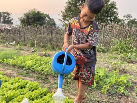 Don is enjoying his after-school-chore: garden watering