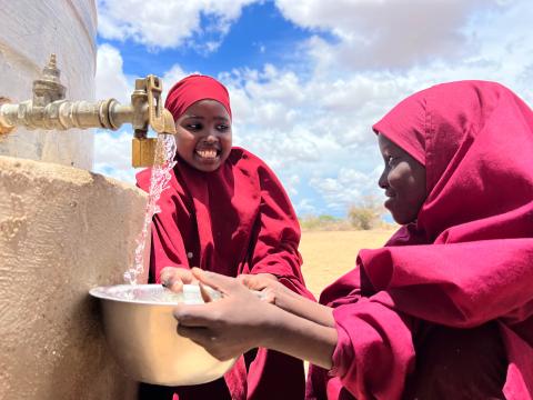 Amina drawing water