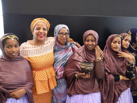 The Regional Director, Carla Denizard, with children, during the ceremony.