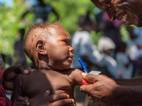 A child receiving his vaccine shot