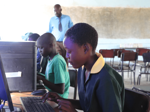Antonette (12) operating a computer