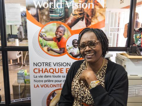 Dina, a World Vision staff in her office