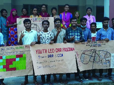 a group of children holding banners