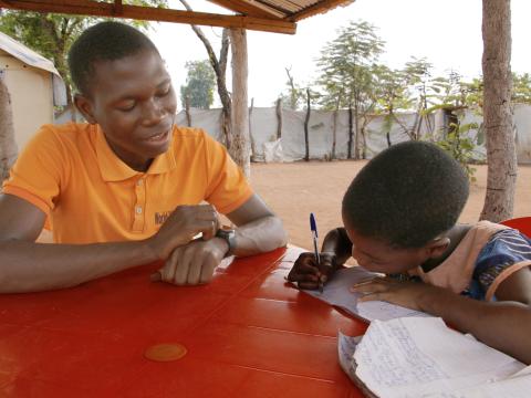 David helping his sister to study