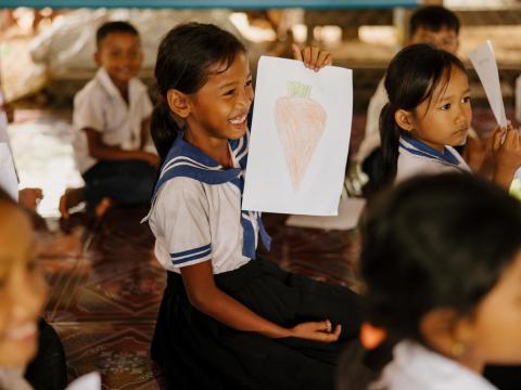 A girl showing her drawing