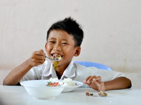 A child eating a meal at school