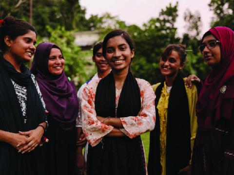 a group of girls smiling