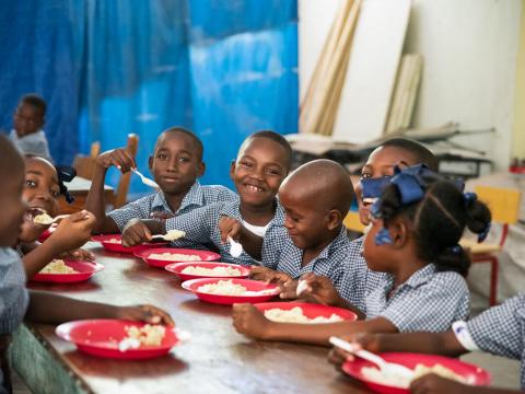 Students participate in a school feeding activity.
