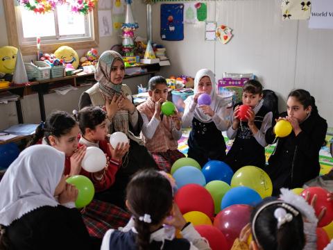 Children in ME playing with balloons