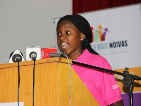 Girl speaking at a conference in Mozambique