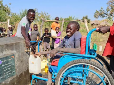 Imagine competing for contaminated river water with animals. Now imagine trying to do it with a disability. Two years ago, that was life for some South Sudanese refugees in Omugo Settlement in Terego District.  Collecting water was a challenge for everyone. Every day people lugged heavy jerrycans filled with polluted water from the River Enyau to use at home.