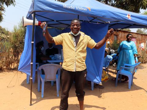 A young man is happy to receive condoms to protect him self against HIV