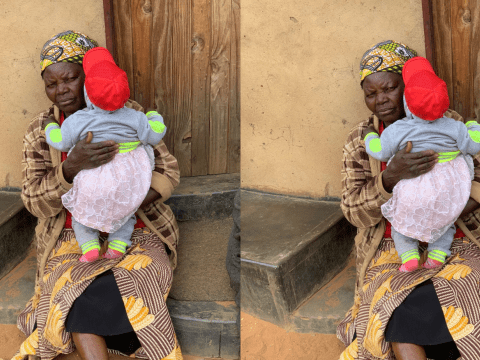 Agnes holding her grand child