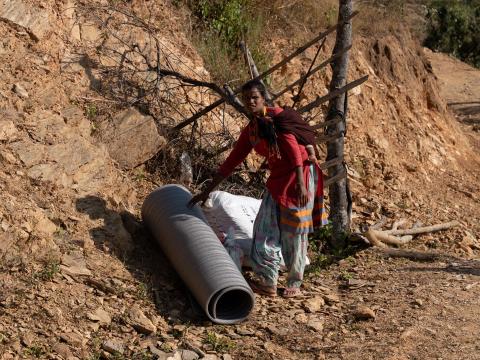 Kalawati receives relief items distributed by WVI Nepal. 