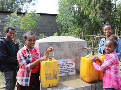 Tesfashwerk Drawing Water from the Water Point Constructed by the WV Sponsorship Programme