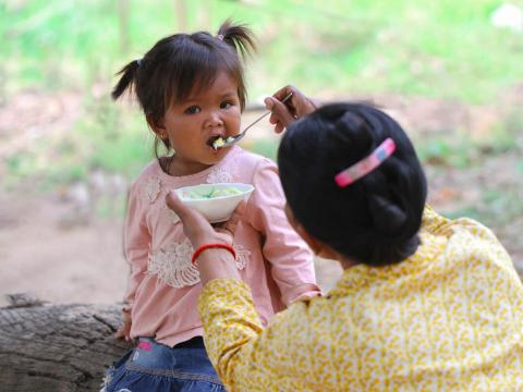 A little girl easting