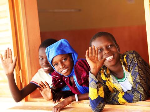 Children waving at the camera
