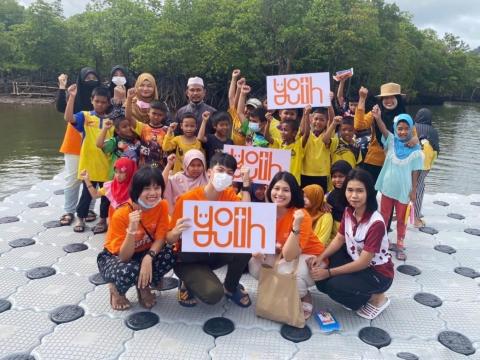 Youth planting mangrove in Thailand