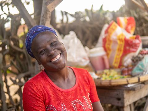 Pierre Gina Seraphin smiles, her small business besides her