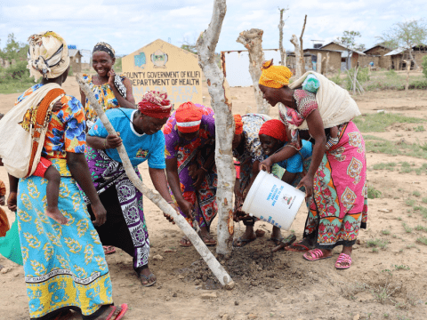 Afya Yetu Jukumu Letu S4T Group installing poles to function as a fence for the Rimarapera dispensary in Kilifi.