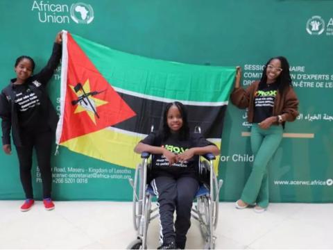 Girls holding Mozambique flag