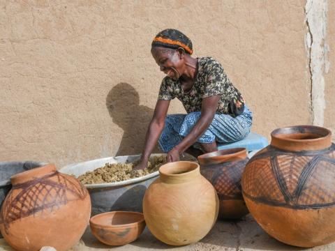 Asaah Awinpoaga busy moulding pots