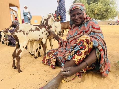 Woman with her goat.