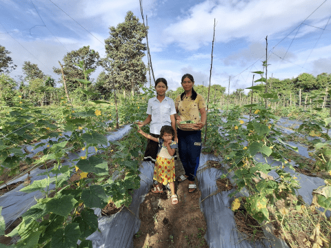 Sochan and her children at their cucumber farm.