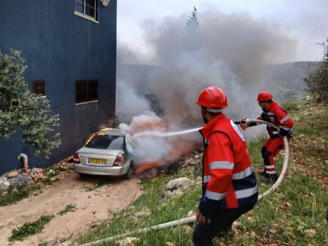 Palestinian volunteers are responding to a fire with emergency material