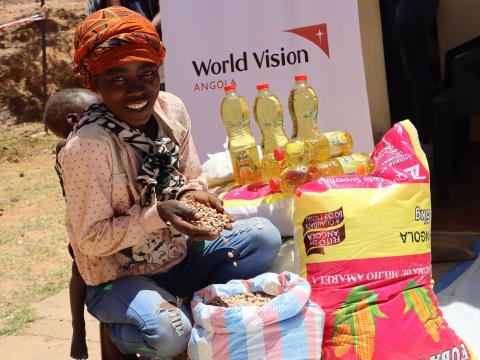 Beneficiary of the project receiving the basic food basket