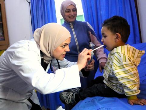 Palestinian children receives health care in a stabilization point