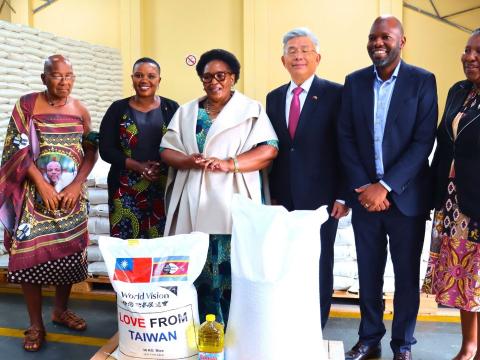 Stakeholders handing over rice to the National Disaster Management Agency.