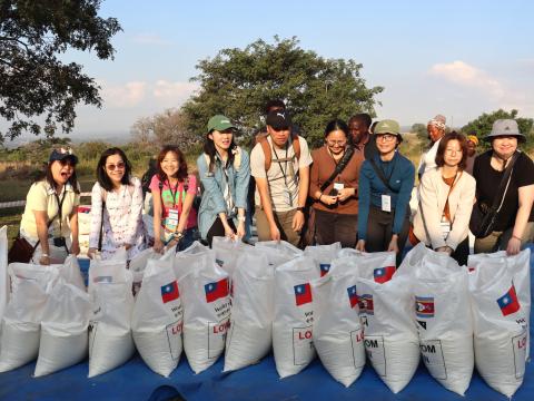 Taiwanese with bags of rice donated to vulnerable families in Eswatini