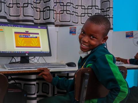 David showcasing a certificate that he designed using Microsoft Publisher