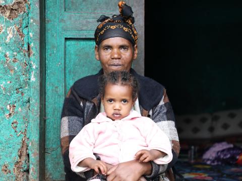 Kelemwa with her child fiker at their doorway