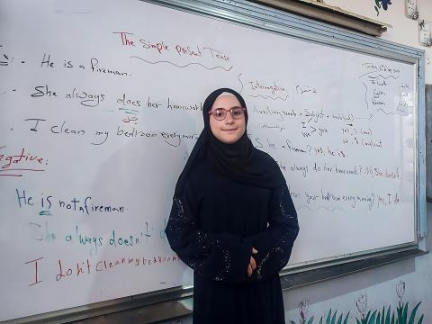 Lina* in her class with her new glasses, World Vision Syria Response
