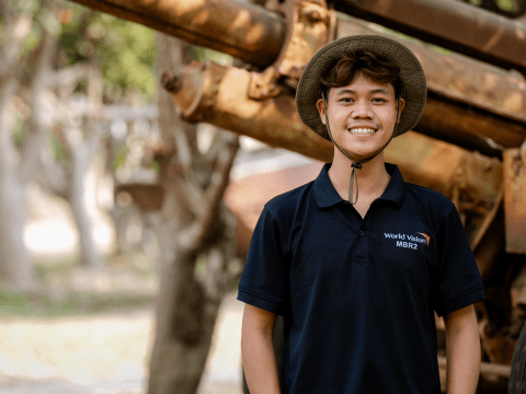 Adolescents from Cambodia smiles to the camara.