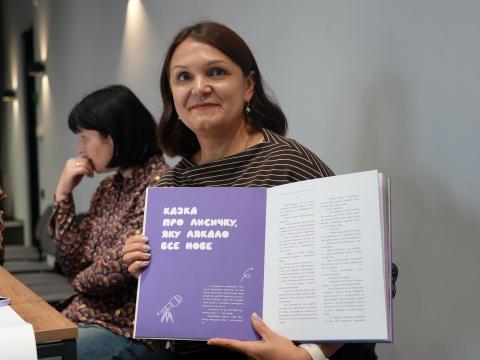 Svitlana showing fairy tale book